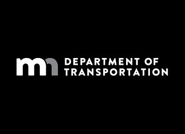 MnDOT horizontal logo in reverse grayscale